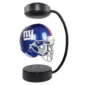 Floating New York Giants helmet levitating under a black magnetic frame.