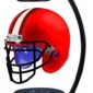 Red football helmet levitating between two black magnetic stands with a blue light base.