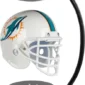 Floating Miami Dolphins helmet on a black stand with magnetic suspension.