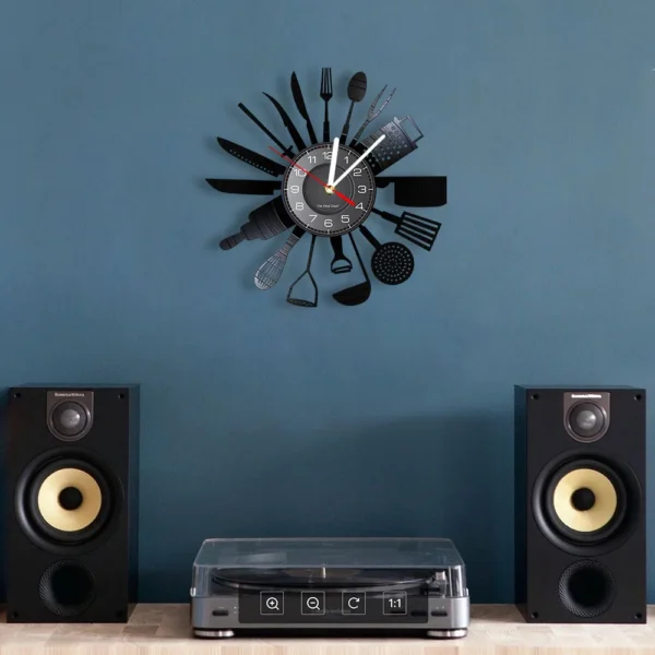 Cooking Set Wall Clock Knife Fork Spoon Vinyl Record Kitchen Home Decor Reloj De Pared Quartz Watch Zegar Scienny 5 Wall clock with kitchen utensil design as hour markers, mounted on a blue wall above a turntable and speakers.