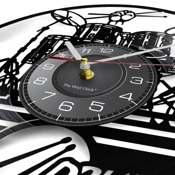 Drummers Personalized Drum Wall Clock Music Instrument Drum Kit Wall Decor Vinyl Record Wall Clock Music Lover Drummers Gift 3 Close-up of a clock designed to look like a vinyl record, featuring a black dial with white numbers and drum set illustration in the background.
