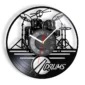 A wall clock with a cut-out vinyl record design featuring a drum kit silhouette and the word "Drums" below.
