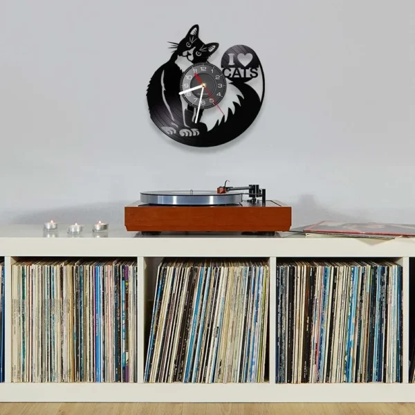 I Love Cats Cute Kitty Rescue Wall Art Silent Clock Lovely Pet Adoption Kittens Home Decor Cat Shop Vinyl Record Hanging Watch 6 Wall-mounted cat-themed clock above a shelf full of vinyl records and a record player.