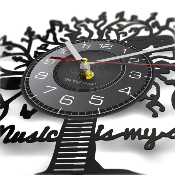 Music is My Soul Modern Design Music Classic Black Hanging Vinyl Record Clocks Wall Watch Home Decor Musician Rock n Roll Gift 3 Close-up of a clock with a black vinyl record design. The clock face has white numerals, and stylized cutouts form a tree and the text "music" at the base.