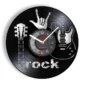 A wall clock with a vinyl record design featuring guitar silhouettes, a clock face with white numbers, and the word "rock" at the bottom.