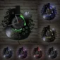 Wall clock shaped like a guitar with a vinyl record design, illuminated with colorful LED lights.