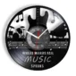 A wall clock designed like a vinyl record features musical instruments and notes. Text reads, "Where words fail, music speaks.