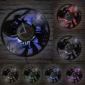 Wall-mounted clocks with guitar-themed designs, each illuminated in different colored LED lights against a brick background.