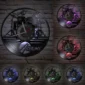 Wall clocks featuring a drum kit design, displayed with different colored lights.