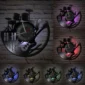 Wall clock with music-themed design, featuring guitars and drums, displayed in six different LED colors against a brick background.
