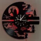 Clock made from a vinyl record featuring sci-fi themed silhouettes around the edges, with a red light glowing behind.