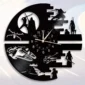 Vinyl record wall clock with intricate sci-fi character silhouettes and starship designs surrounding the clock face.