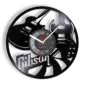 Wall clock featuring guitar designs with the word "Gibson" in stylized text. The clock has black and white colors with red and white hands.