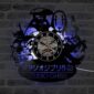 Wall clock featuring silhouettes of Studio Ghibli characters and logo, set against a brick wall backdrop.
