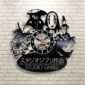 Wall clock designed with Studio Ghibli character silhouettes against a white brick wall.
