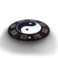 A circular black device with a yin-yang symbol in the center, surrounded by eight trigrams, and a power button at the bottom.