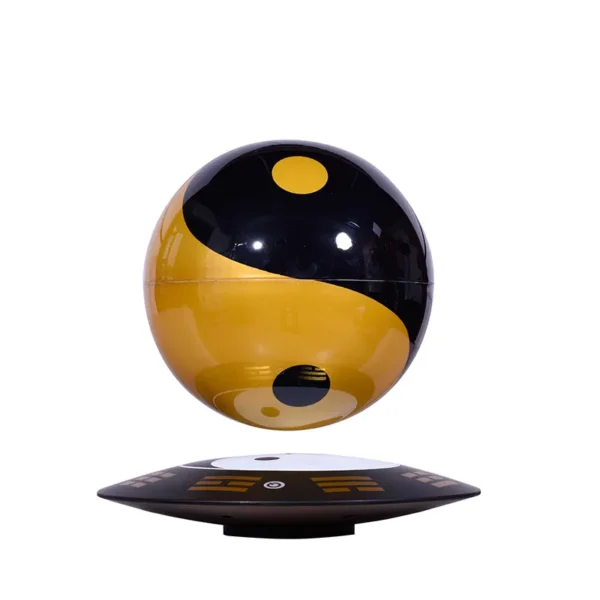 HCNT Feng Shui ornaments Yin and Yang Tai Chi ball home decoration levitation ball 3 A black and gold sphere with a yin-yang design hovers above a black, rectangular base.