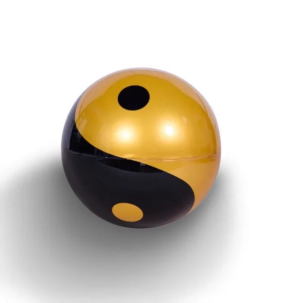 HCNT Feng Shui ornaments Yin and Yang Tai Chi ball home decoration levitation ball 5 A black and gold yin-yang ball on a white background.