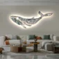 A modern living room with a glowing whale wall art above a beige sofa. Two round coffee tables with various decorative items are in front of the sofa.