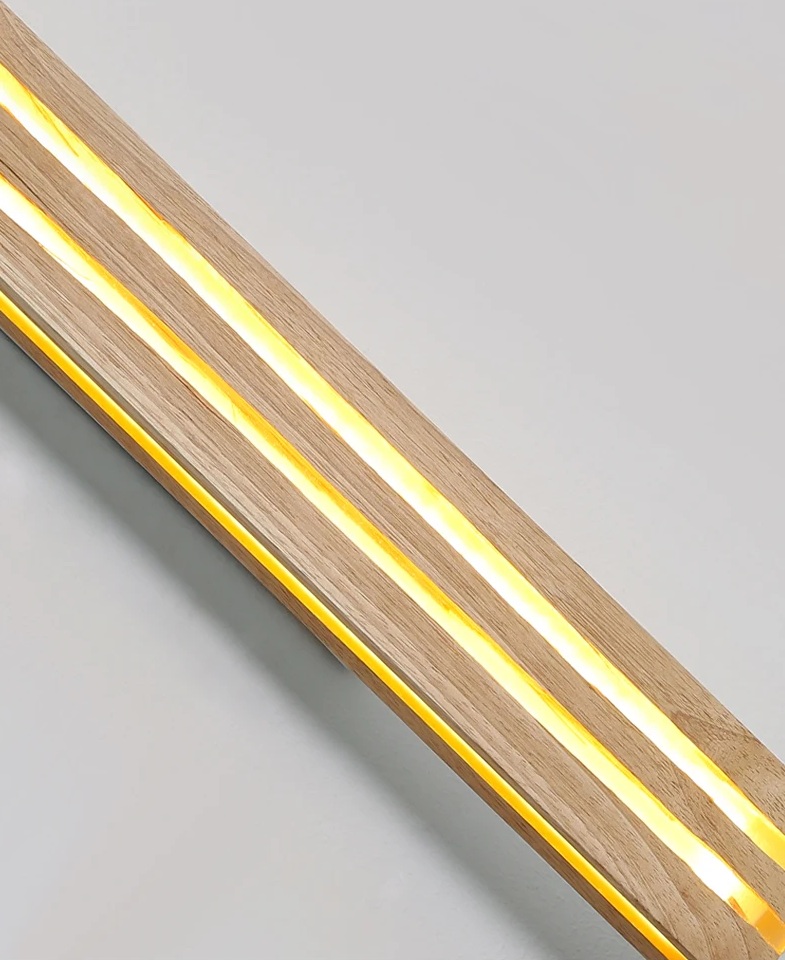 Wooden LED light strip with two parallel yellow-lit lines on a light gray background.