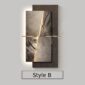 Decorative wall panel with a textured, abstract design and layered brown slate-like elements. A thin gold horizontal line divides the panel. Labeled "Style B.